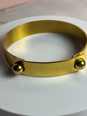 Soo Ihn Kim golden bangle